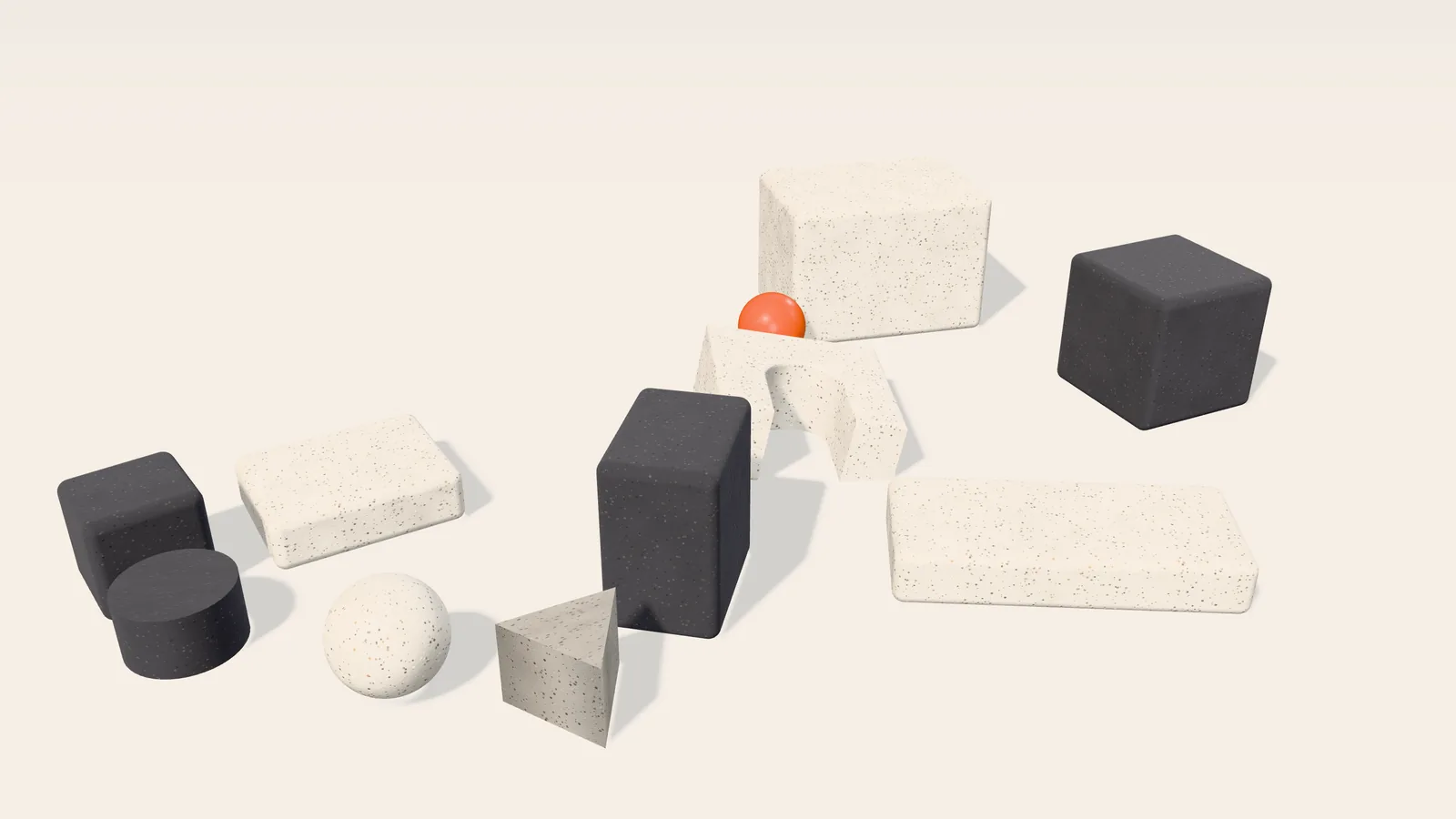 Rendered 3D studio scene: stone and charcoal blocks lie scattered on the floor, with an orange ball among them.